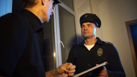 Two police us communicate Stock Footage 69883403