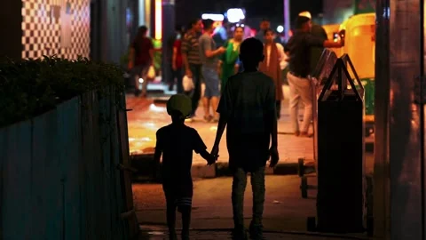 Two Poor Kids Step Into the City  A Journey of Dreams and Struggles Stock Footage 316330875