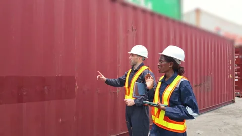 Two Port Worker Walking And Inspecting Logistics Cargo Container in Termina.. Stock Footage 344983932