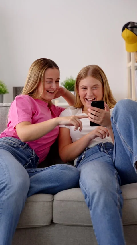 Two positive women using dating app Stock Footage 247114664