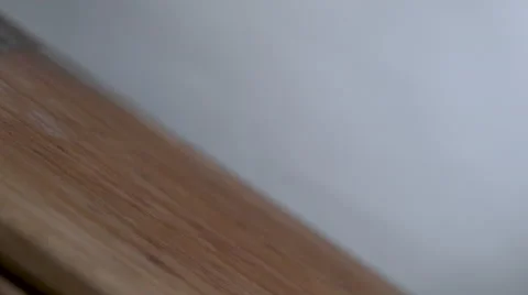 Two potatoes bounce in slow motion onto a cutting board Stock Footage 64849643