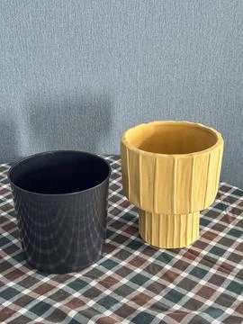 Two pots are on a checkered tablecloth Stock Photos