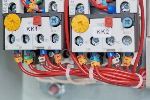 Two power contactor with adjustable and connected to it by wires. Stock Photos