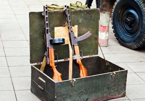 Two PPSH with disc and box magazine, in a box from under ammunition Stock Photos