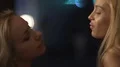Two pretty females dancing, flirting in nightclub, touching each other gently HD Footage