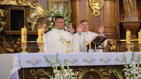 Two priests are praying in the Catholic church. Stock Footage 132241965