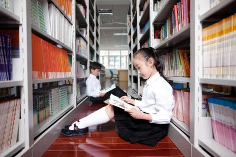 Two primary school students studying in a photo gallery Stock Photos