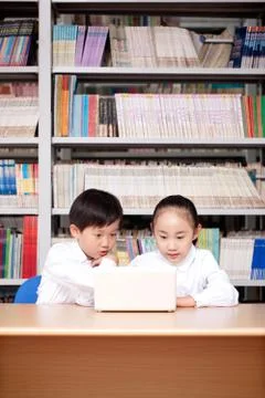 Two primary school students studying in a photo gallery Stock Photos