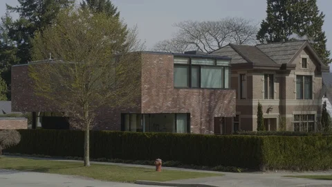 Two private houses side by side, different design. Style. Stockbeeldmateriaal 128189209
