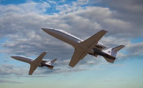 Two private jets flying close to each other Stock Photos