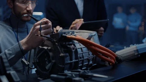 Two Professional Automotive Engineers with a Tablet Computer and Inspection Tool Video stock 105848690