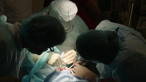 Two professional doctors perform dental surgery Stock Footage 236052879