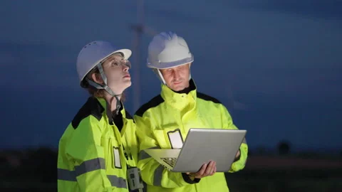 Two professional engineers in safety uniforms Stock Footage 325561178
