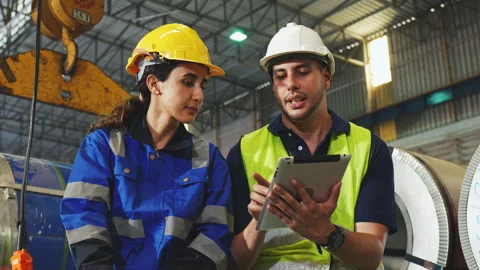 Two professional industrial engineer worker using digital tablet for workin.. Stock Footage 242714078