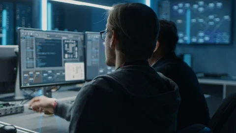 Two Professional IT Programers Discussing Blockchain Data Network Architecture Stock Footage 103271933