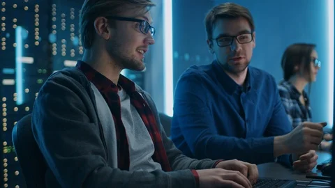 Two Professional IT Programers Discussing Technical Data Show on Desktop PC Stock Footage 103276297