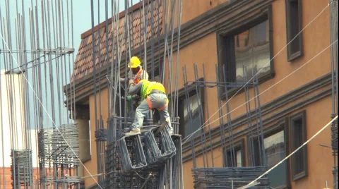 Two Professional Laborers High Up in a New Construction Project Video stock 60425197
