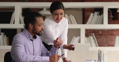 Two professional mixed race managers developing growth strategy. Video stock 155926930
