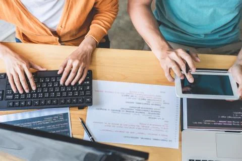 Two professional programmer cooperating and working on web site project in a Stock-Fotos