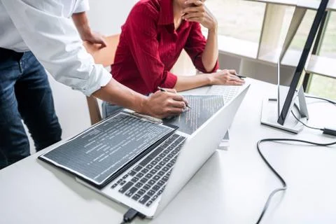 Two professional programmer cooperating and working on web site project in a Stock-Fotos