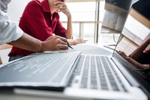 Two professional programmer cooperating and working on web site project in a Stockfoto's