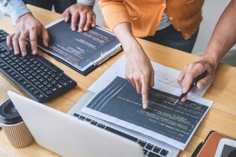 Two professional programmer cooperating and working on web site project in a Stock-Fotos