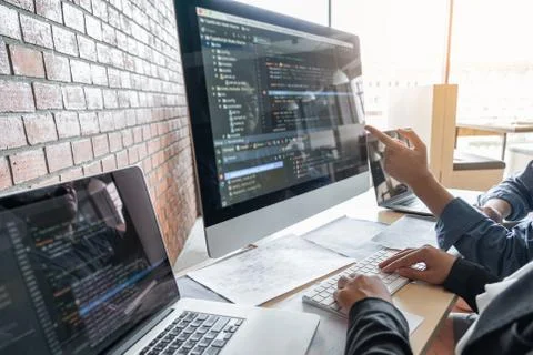 Two professional programmer cooperating and working on web site project in a Stockfoto's