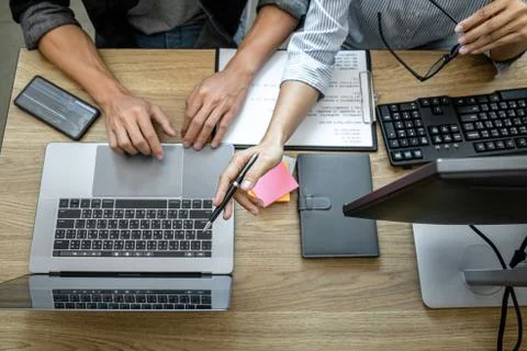 Two professional programmer cooperating and working on web site project in a Stock-Fotos