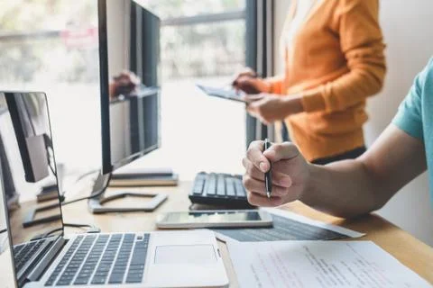 Two professional programmer cooperating and working on web site project in a Stockfoto's