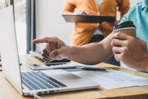 Two professional programmer cooperating and working on web site project in a Stock-Fotos