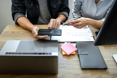 Two professional programmer cooperating and working on web site project in a Stock-Fotos