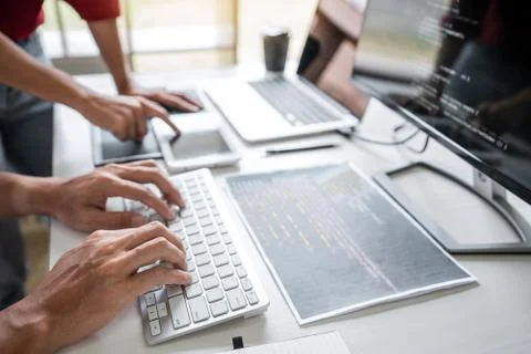 Two professional programmer cooperating and working on web site project in a Stockfoto's