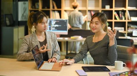 Two professional programmer cooperating and working together development website Stock Photos