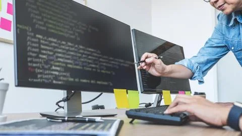 Two professional programmers cooperating at Developing programming and websit Stock Photos