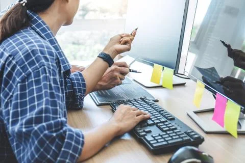 Two professional programmers cooperating at Developing programming and websit 库存照片