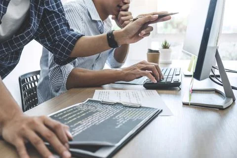 Two professional programmers cooperating at Developing programming and websit Stock Photos