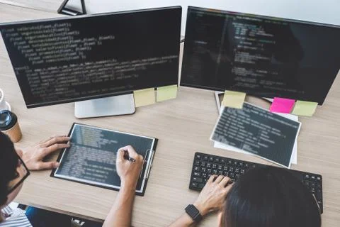 Two professional programmers cooperating at Developing programming and websit Foto stock