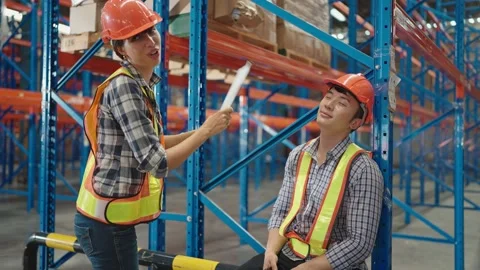 Two professional workers talking and sitting a break in warehouse Stock Footage 211973936