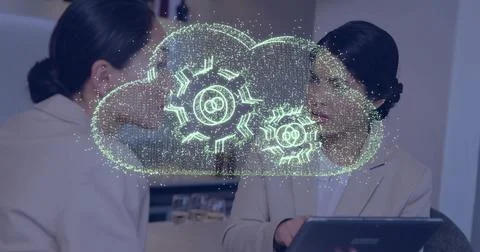 Two professionals discussing technology with cloud and gears image overlay Stock Photos