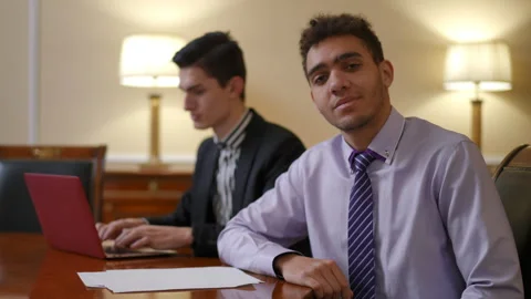 Two Professionals Engaged in Collaborative Work within a Modern Office  Stock Footage 291547906