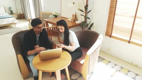 Two professionals working remotely in a home office, discussing ideas. 스톡 동영상 302350428