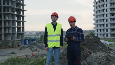 Two proffesional workers look on the building 스톡 동영상 157871716
