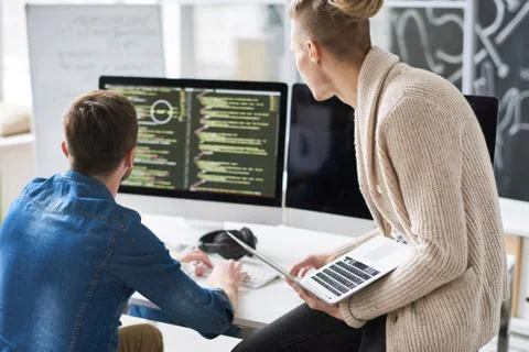 Two Program Developers Collaborating on Project Stock Photos