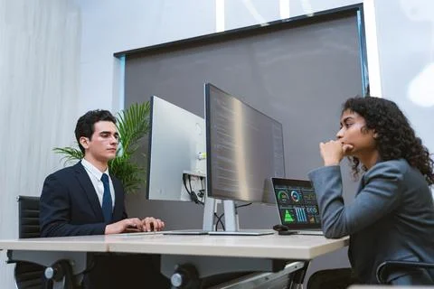 Two programmer is dealing with the stress and anxiety of working on compute.. Stockfoto's