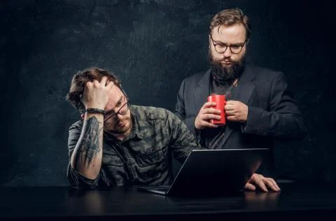 Two programmers are thinking hard, trying to find a solution to the problem in 스톡 사진