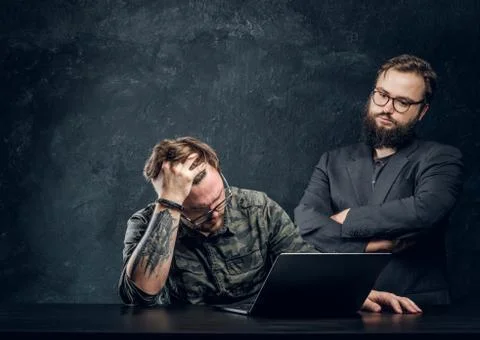 Two programmers are thinking hard, trying to find a solution to the problem in 스톡 사진