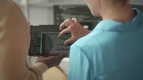Two Programmers Discussing Code on Digital Tablet 動画素材 263729236