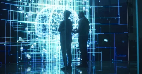 Two Programmers Discussing Data on Big Screen Stock Footage 243290118