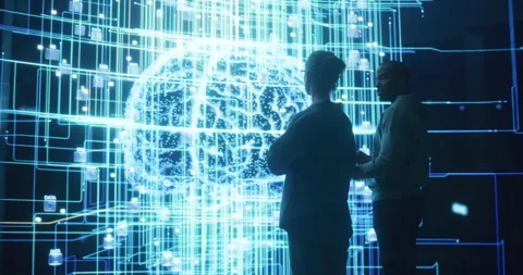 Two Programmers Discussing Data on Big Screen Stock Footage 243290188