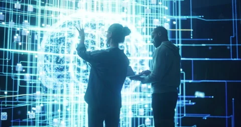 Two Programmers Discussing Data on Big Screen Stock Footage 243290238